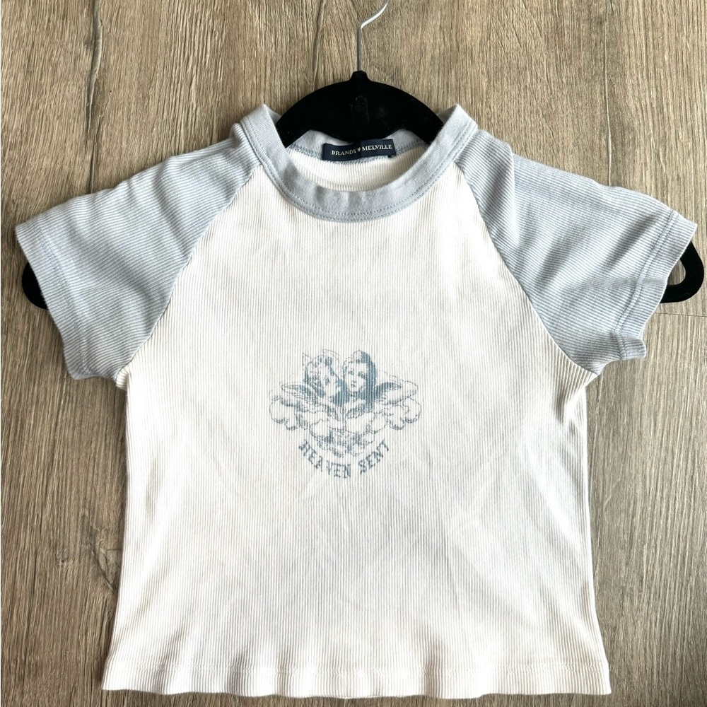 Brandy Melville “Heaven Sent” Baby Blue and White Cropped T-Shirt